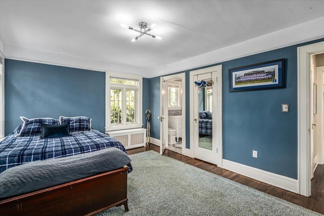 bedroom featuring baseboards, radiator heating unit, french doors, and wood finished floors