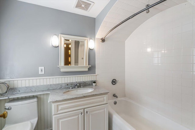full bath featuring vanity, toilet, tub / shower combination, and visible vents
