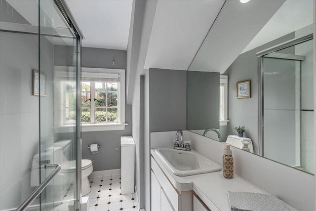 full bath with vanity, toilet, baseboards, and a stall shower