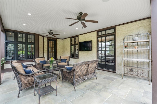view of patio / terrace with french doors, ceiling fan, and an outdoor living space