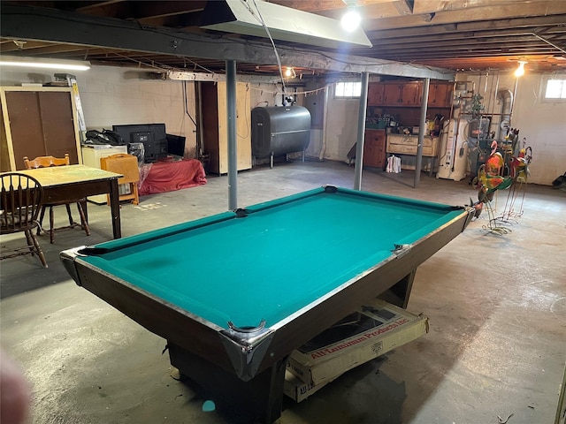 game room with heating fuel and concrete flooring
