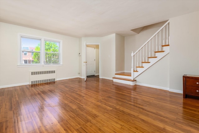 150-20 77th Ave, Kew Garden Hills, NY 11367 - interior space with baseboards, radiator, hardwood / wood-style floors, and stairway