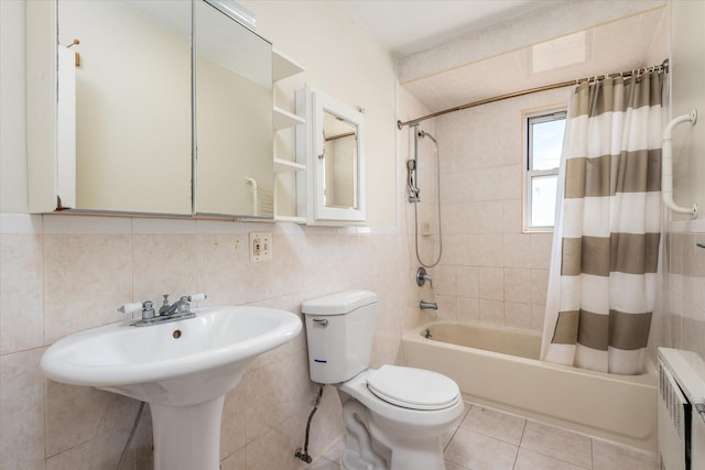150-20 77th Ave, Kew Garden Hills, NY 11367 - full bathroom featuring radiator, toilet, tile walls, shower / bathtub combination with curtain, and tile patterned floors