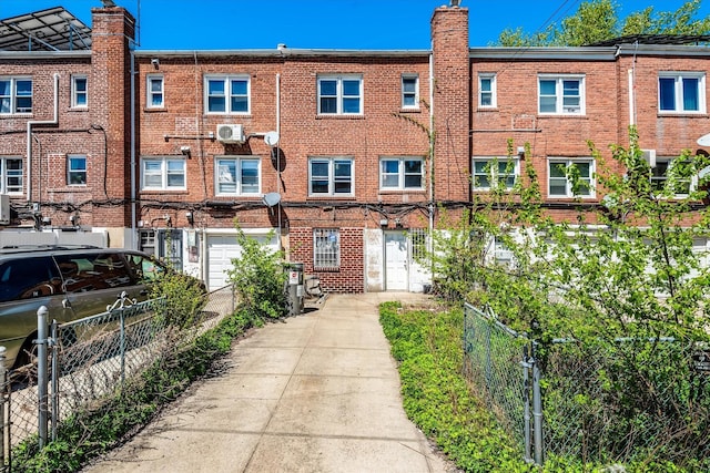 150-20 77th Ave, Kew Garden Hills, NY 11367 - exterior space featuring fence, driveway, and brick siding