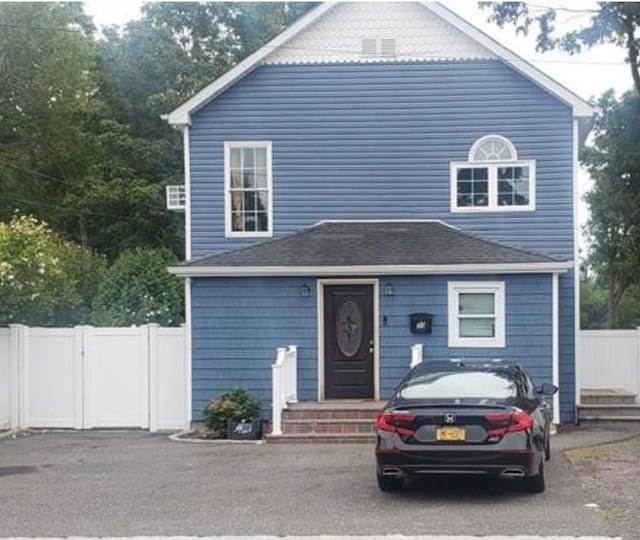 30 Mindres Ave, Brentwood, NY 11717 - view of front of home with fence and entry steps
