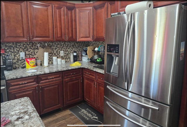 30 Mindres Ave, Brentwood, NY 11717 - kitchen featuring stainless steel fridge, dark wood-type flooring, light stone counters, and backsplash