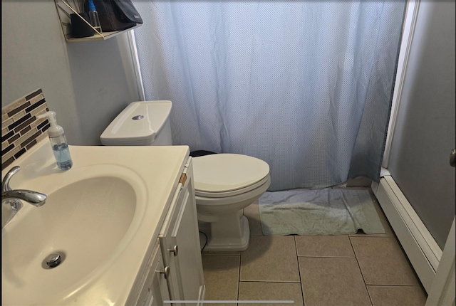 30 Mindres Ave, Brentwood, NY 11717 - bathroom featuring tile patterned floors, vanity, toilet, and curtained shower