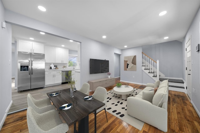 living room with stairway, baseboards, recessed lighting, and dark wood finished floors