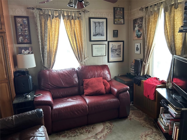 104-35 198th St, Saint Albans, NY 11412 - carpeted living room featuring a ceiling fan and a healthy amount of sunlight