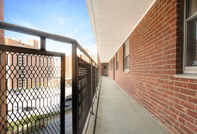 view of side of home featuring brick siding