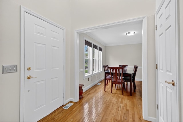 50 Roosevelt Dr, Poughquag, NY 12570 - dining room with light wood finished floors and crown molding