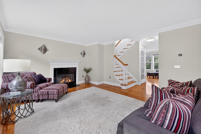 50 Roosevelt Dr, Poughquag, NY 12570 - living room featuring stairs, wood finished floors, crown molding, and a fireplace with flush hearth