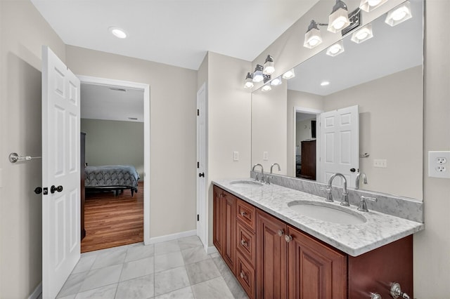 50 Roosevelt Dr, Poughquag, NY 12570 - full bathroom with ensuite bathroom, double vanity, and marble look tile flooring