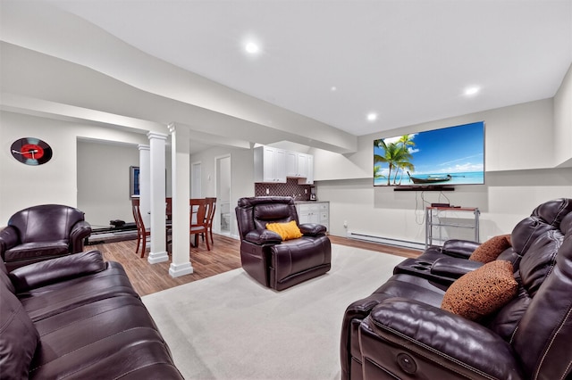 50 Roosevelt Dr, Poughquag, NY 12570 - living room featuring baseboard heating, light wood-style floors, ornate columns, and recessed lighting