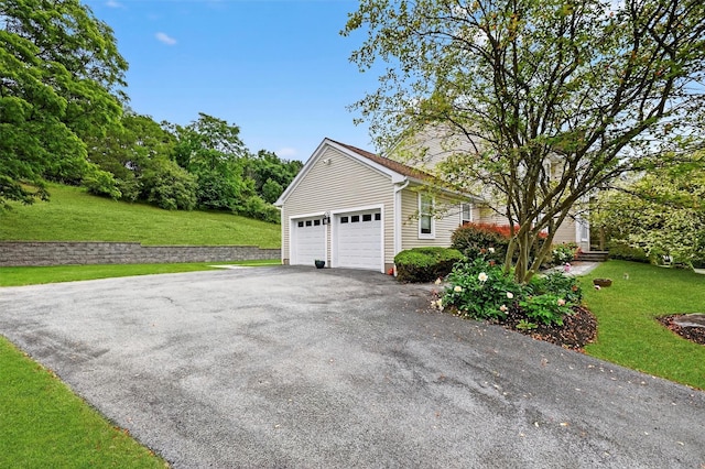 50 Roosevelt Dr, Poughquag, NY 12570 - view of property exterior with driveway, a lawn, and an attached garage