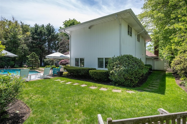 94 Schoolhouse Ln, Roslyn Heights, NY 11577 - view of grassy yard featuring an outdoor pool and a gate