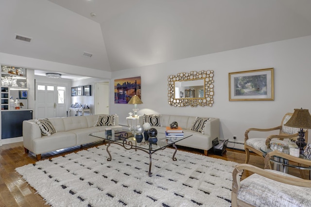 94 Schoolhouse Ln, Roslyn Heights, NY 11577 - living room featuring wood finished floors and lofted ceiling