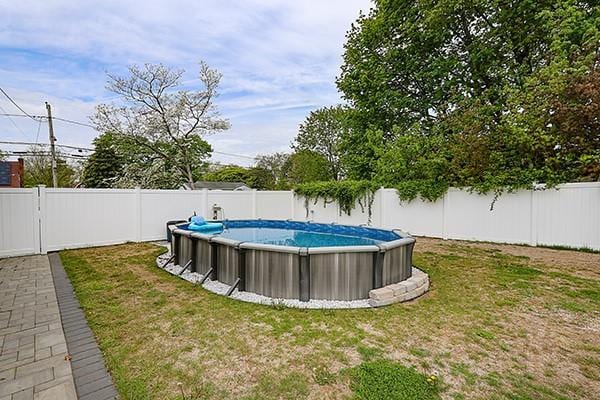 view of yard with a fenced backyard and a fenced in pool