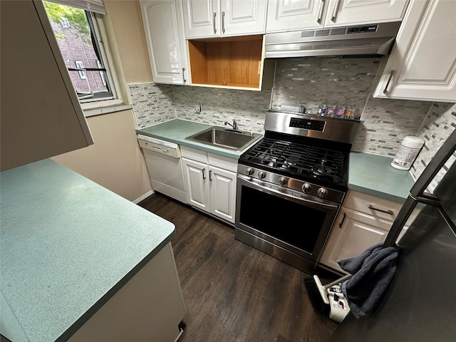 kitchen featuring dark wood-style flooring, a sink, dishwasher, stainless steel gas stove, and under cabinet range hood