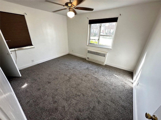 unfurnished room featuring radiator, ceiling fan, baseboards, and carpet flooring