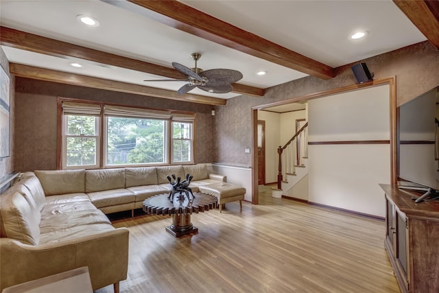 living room featuring light wood finished floors, ceiling fan, beam ceiling, stairway, and recessed lighting