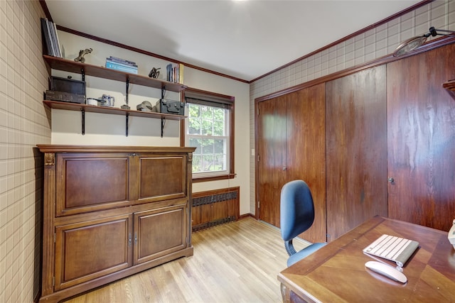 home office featuring radiator heating unit, ornamental molding, light wood-style floors, and baseboards