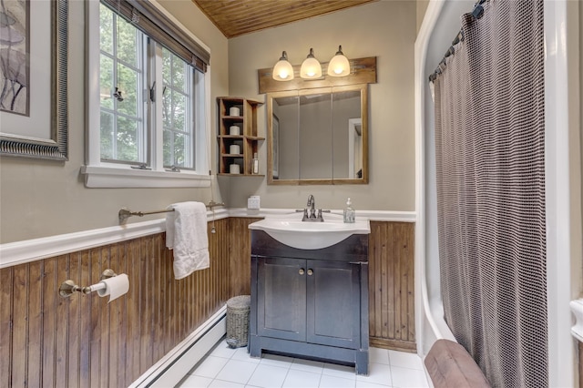 full bath featuring a wainscoted wall, tile patterned floors, vanity, a shower with curtain, and wooden ceiling