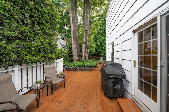 wooden deck with area for grilling