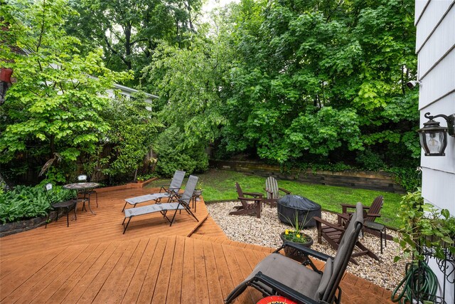 deck featuring an outdoor fire pit