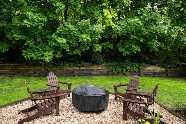 view of patio / terrace featuring an outdoor fire pit