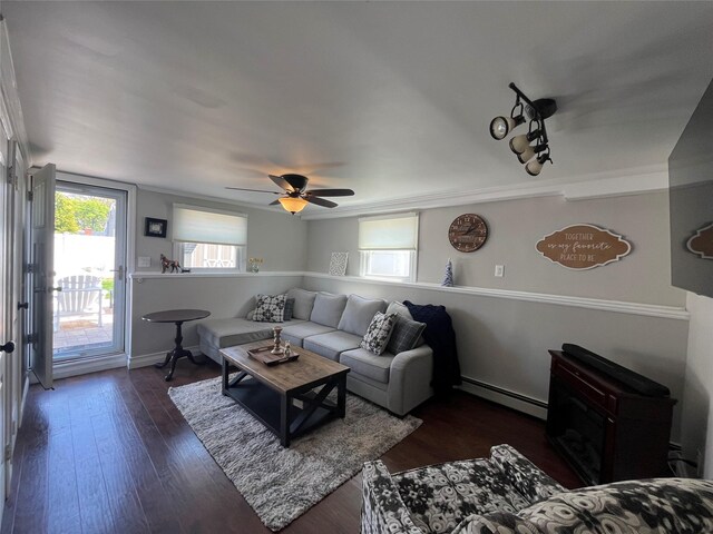 living room with ceiling fan, wood finished floors, and baseboard heating