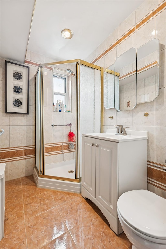 153-25 88th St Unit 3D, Howard Beach, NY 11414 - full bath featuring tile walls, vanity, a shower stall, and tile patterned flooring