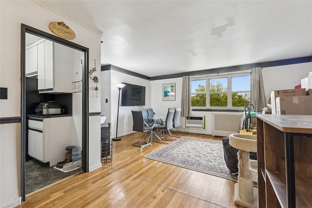 153-25 88th St Unit 3D, Howard Beach, NY 11414 - office with wood-type flooring, an AC wall unit, radiator, and crown molding