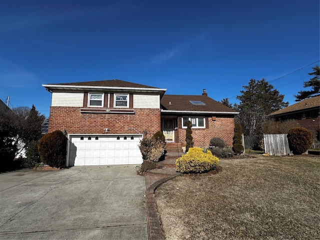 827 Eastfield Rd, Westbury, NY 11590 - split level home with concrete driveway, brick siding, and an attached garage