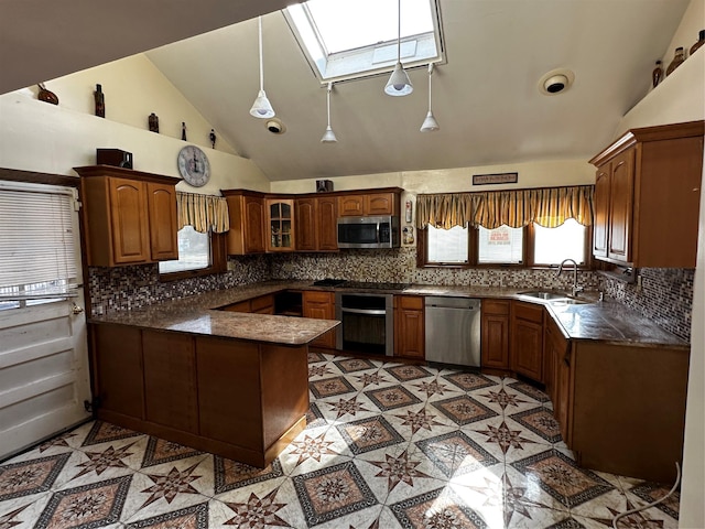 827 Eastfield Rd, Westbury, NY 11590 - kitchen with a skylight, dark countertops, a peninsula, glass insert cabinets, and stainless steel appliances