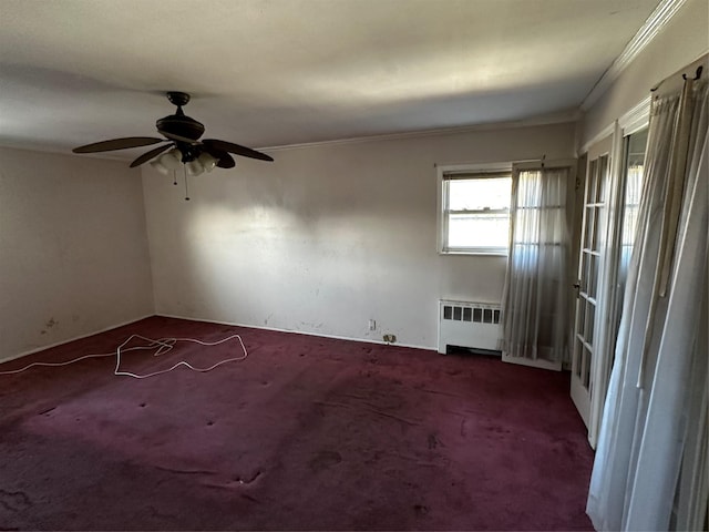 827 Eastfield Rd, Westbury, NY 11590 - carpeted spare room featuring a ceiling fan, ornamental molding, and radiator