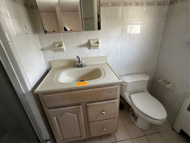 827 Eastfield Rd, Westbury, NY 11590 - bathroom featuring tile patterned flooring, vanity, toilet, and tile walls