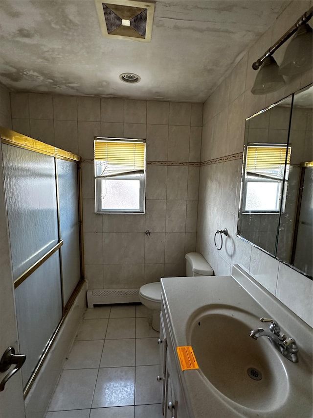 827 Eastfield Rd, Westbury, NY 11590 - full bath featuring tile walls, visible vents, a healthy amount of sunlight, and a shower with shower door