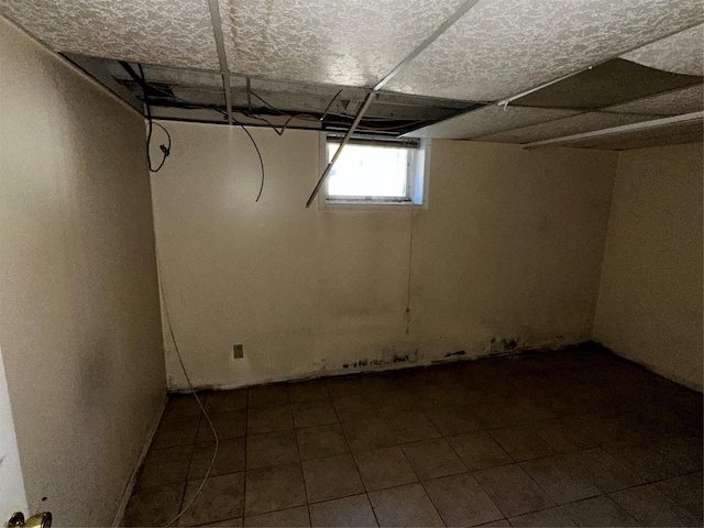 827 Eastfield Rd, Westbury, NY 11590 - basement with dark tile patterned floors