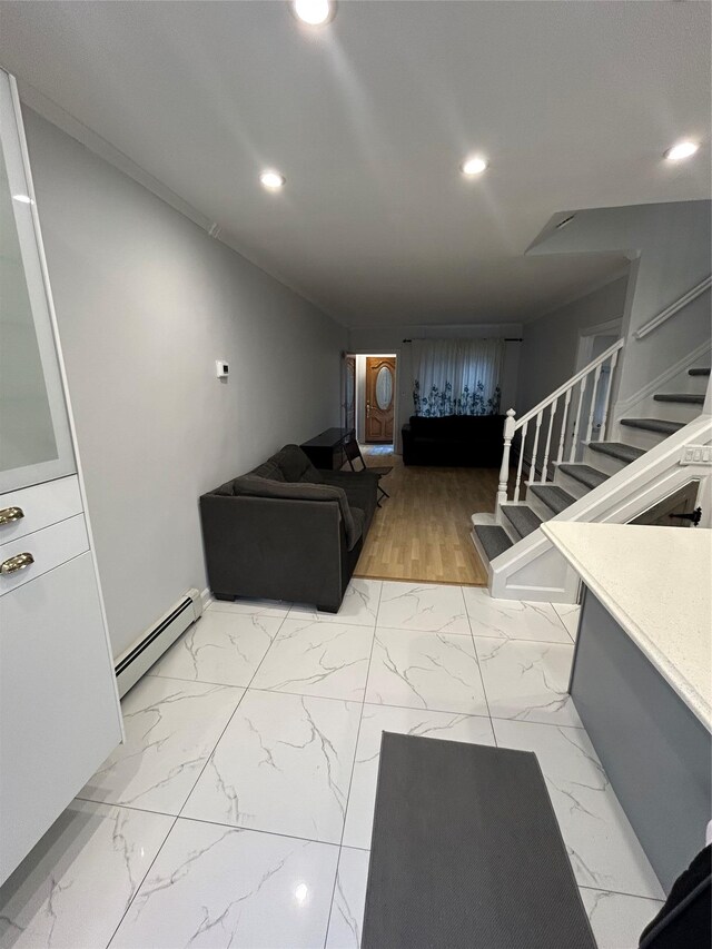 living room with baseboard heating, light marble finish flooring, stairs, recessed lighting, and baseboards