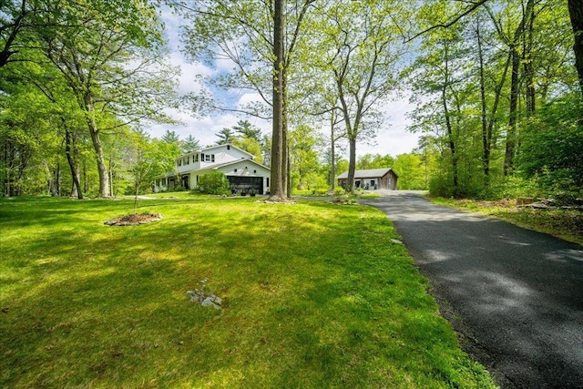 78 Schultz Hill Rd, Rhinebeck, NY 12580 - view of front of property featuring a garage, asphalt driveway, and a front lawn