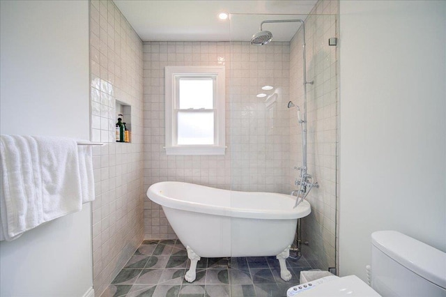78 Schultz Hill Rd, Rhinebeck, NY 12580 - bathroom featuring a freestanding bath, toilet, tile walls, a tile shower, and tile patterned floors