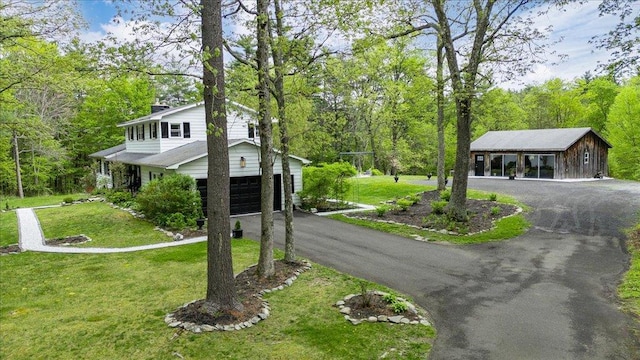 78 Schultz Hill Rd, Rhinebeck, NY 12580 - view of front of property with asphalt driveway, a garage, a front yard, and a chimney