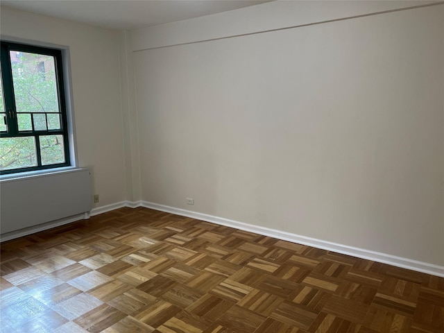 empty room with baseboards