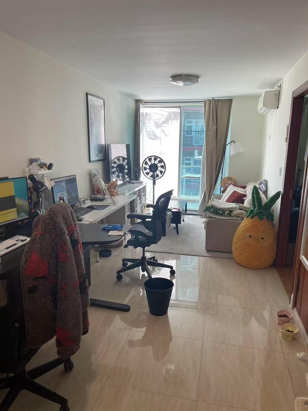 office area featuring tile patterned flooring and a wall mounted air conditioner