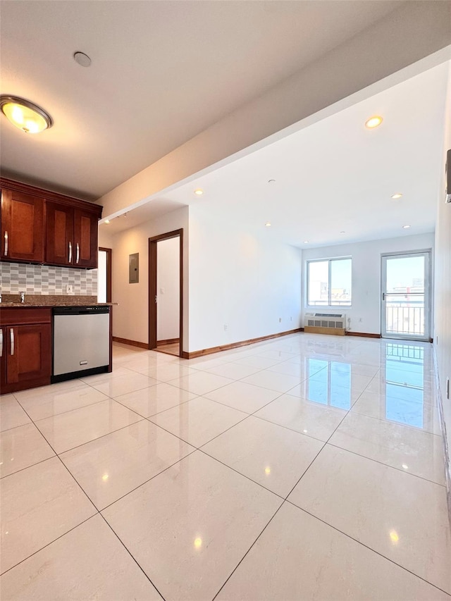 kitchen with stainless steel dishwasher, dark countertops, baseboards, light tile patterned floors, and backsplash