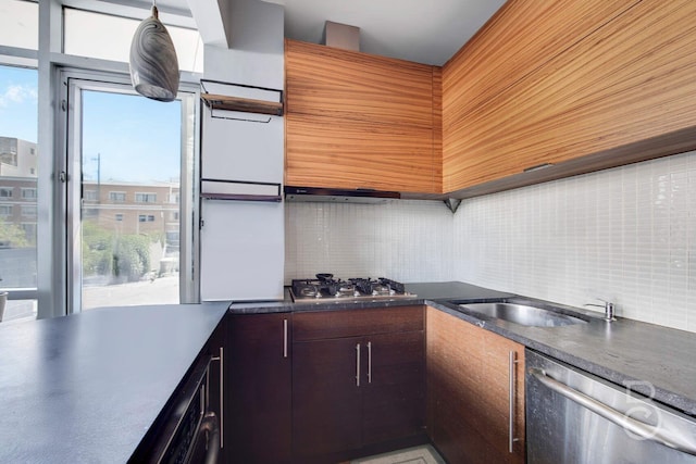 11-24 31st Ave Unit 3A, Astoria, NY 11106 - kitchen featuring appliances with stainless steel finishes, decorative backsplash, and plenty of natural light