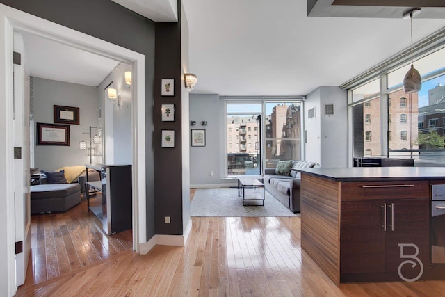 11-24 31st Ave Unit 3A, Astoria, NY 11106 - living area featuring light wood-style floors and baseboards