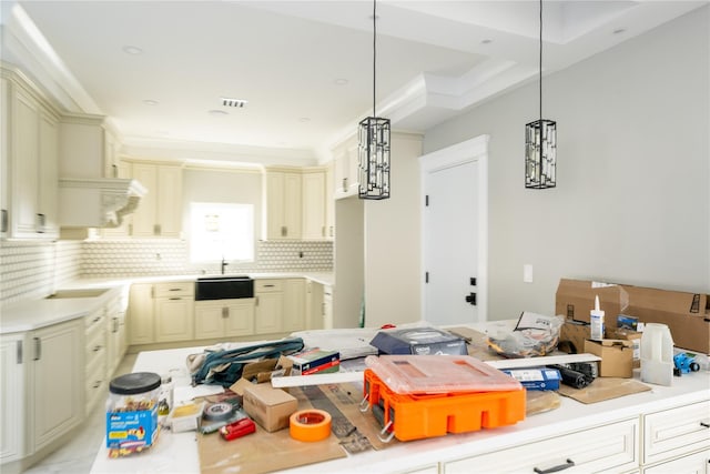 26 Kingston Ave, Hicksville, NY 11801 - kitchen with backsplash, decorative light fixtures, cream cabinets, and light countertops