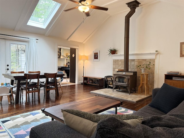 101 Old Plank Rd, Sparrowbush, NY 12780 - living area with a wood stove, wood finished floors, a ceiling fan, a skylight, and high vaulted ceiling